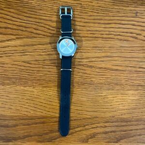 Movado women’s watch. Blue strap with stainless steal and rose gold face.